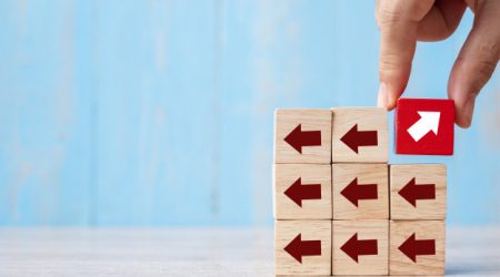 businessman-hand-placing-pulling-red-block-with-different-direction-arrow-table-background-business-growth-improvement-strategy-successful-different-unique_42256-1716